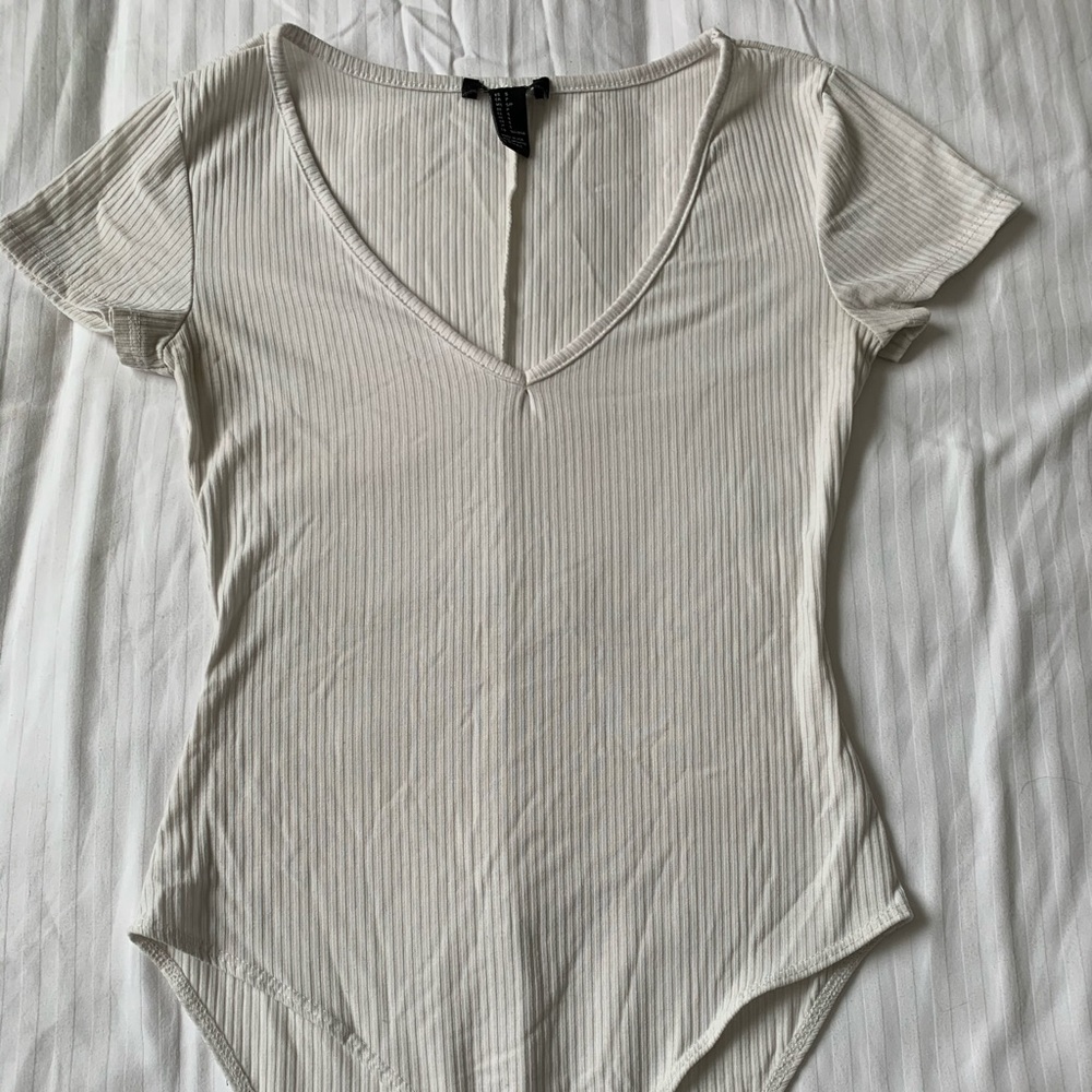 Off white colored body suit